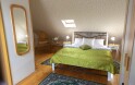 Podkrovný apartmán s rohovou vaňou, Penzión Trámky, Vikýřovice, Jeseníky